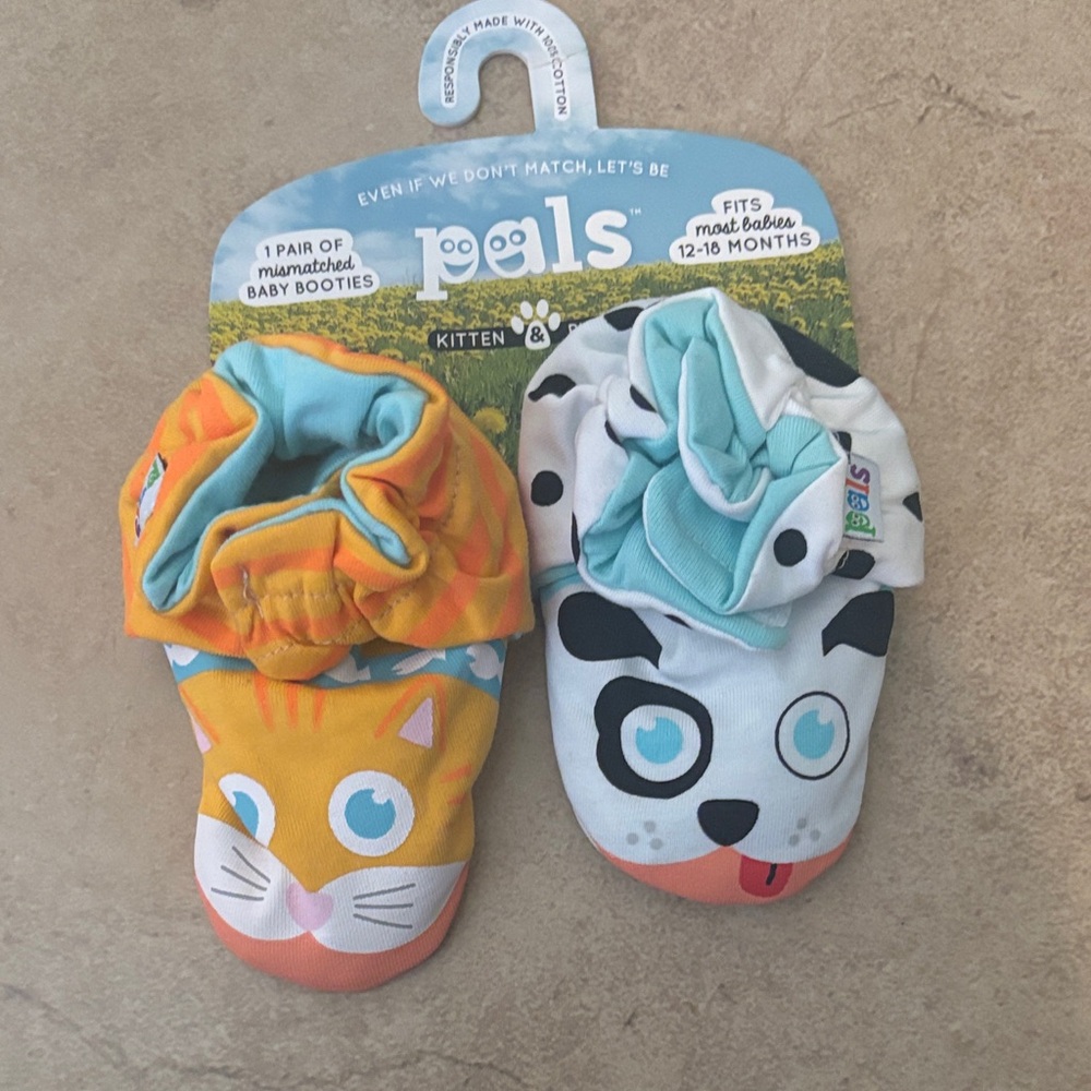 1 pair of mismatched baby booties 12-18 months